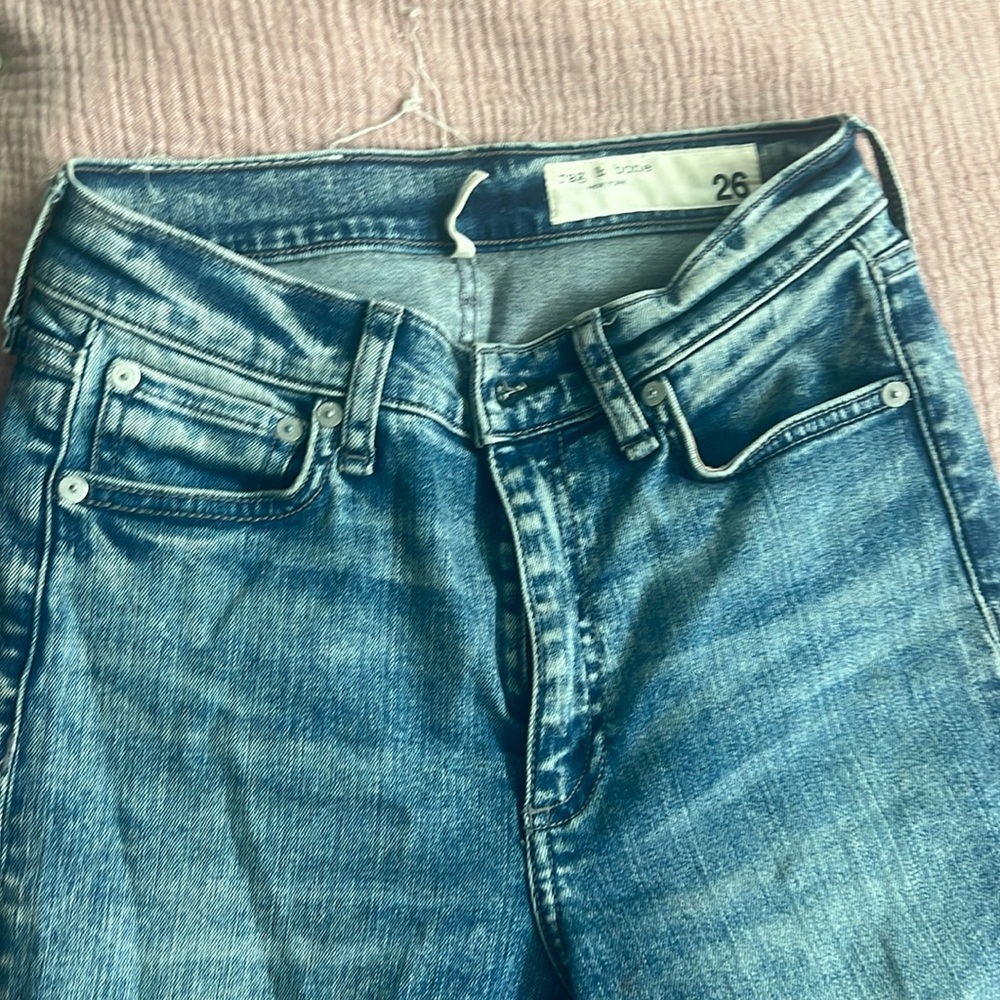 Blue denim rag and bone skinny jeans. Looser fit. Frayed boot cut. Size 26.